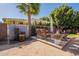 Relaxing backyard with firepit, water feature, and seating area at 1397 E Verde Blvd, Queen Creek, AZ 85140