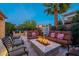 Outdoor living space featuring a built-in barbecue, bar area and fire pit at 1397 E Verde Blvd, Queen Creek, AZ 85140