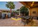 Backyard patio featuring a water feature, fire pit and comfortable seating at 1397 E Verde Blvd, Queen Creek, AZ 85140