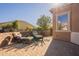 Relaxing backyard patio with comfortable wicker chairs at 1397 E Verde Blvd, Queen Creek, AZ 85140