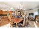 Spacious dining area with large wooden table and leather chairs at 1397 E Verde Blvd, Queen Creek, AZ 85140