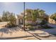 House exterior with lush landscaping and a gated entryway at 1397 E Verde Blvd, Queen Creek, AZ 85140