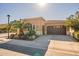 Single-story home with two car garage and landscaping at 1397 E Verde Blvd, Queen Creek, AZ 85140