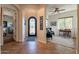 Inviting foyer featuring arched doorways, tile flooring, and a view into the adjacent living spaces at 1397 E Verde Blvd, Queen Creek, AZ 85140