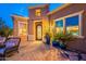 Stunning front patio with a stylish tiled entrance, potted plants, and comfortable outdoor seating at 1397 E Verde Blvd, Queen Creek, AZ 85140