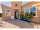 Front entry with decorative planters and a door at 1397 E Verde Blvd, Queen Creek, AZ 85140