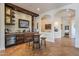 Custom home bar with stone accent wall, wine storage, and seating for four at 1397 E Verde Blvd, Queen Creek, AZ 85140