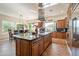 Spacious kitchen with large island, custom cabinetry, and stainless steel appliances at 1397 E Verde Blvd, Queen Creek, AZ 85140