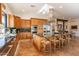 Modern kitchen with granite countertops, stainless steel appliances, and large island at 1397 E Verde Blvd, Queen Creek, AZ 85140