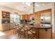 Elegant kitchen with granite island, custom cabinetry, and stainless steel appliances at 1397 E Verde Blvd, Queen Creek, AZ 85140