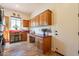 Bright laundry room with built-in cabinetry, workspace, and washer/dryer at 1397 E Verde Blvd, Queen Creek, AZ 85140