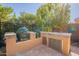 Luxury outdoor kitchen with built-in grills and sink at 1397 E Verde Blvd, Queen Creek, AZ 85140