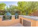 Outdoor kitchen with two large grills and sink at 1397 E Verde Blvd, Queen Creek, AZ 85140