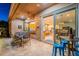 Covered patio with pass-through window to the kitchen and a large sliding door to the dining room at 1397 E Verde Blvd, Queen Creek, AZ 85140