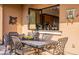 Enjoy the view from this patio with a dining setting and pass-through window at 1397 E Verde Blvd, Queen Creek, AZ 85140