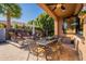 Outdoor patio with seating area, dining table, and fire pit at 1397 E Verde Blvd, Queen Creek, AZ 85140