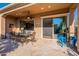 Covered patio features dining area, built-in bar, and sliding glass door at 1397 E Verde Blvd, Queen Creek, AZ 85140