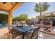 Relaxing patio with seating area, dining table, and grill at 1397 E Verde Blvd, Queen Creek, AZ 85140