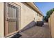 Side yard access with security gate and AC units at 14113 W Windsor Ave, Goodyear, AZ 85395