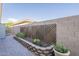 Landscaped garden with raised planters and a trellis at 14113 W Windsor Ave, Goodyear, AZ 85395