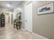 Bright hallway with tile flooring and a console table at 14113 W Windsor Ave, Goodyear, AZ 85395