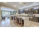 Spacious kitchen with island, stainless steel appliances, and dark wood cabinetry at 14113 W Windsor Ave, Goodyear, AZ 85395