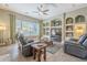 Open living area with built-in shelving and entertainment center at 14113 W Windsor Ave, Goodyear, AZ 85395