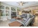 Gathering room with built-in shelving and kitchen views at 14113 W Windsor Ave, Goodyear, AZ 85395