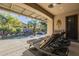 Inviting pool area with a waterfall feature and covered patio at 14113 W Windsor Ave, Goodyear, AZ 85395