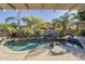 Relaxing kidney-shaped pool surrounded by lush landscaping at 14113 W Windsor Ave, Goodyear, AZ 85395