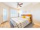 Bright bedroom with wood floors and a king-size bed at 14950 W Mountain View Blvd # 2301, Surprise, AZ 85374