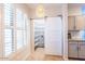 Laundry closet with stackable washer and dryer, hidden behind a barn door at 14950 W Mountain View Blvd # 2301, Surprise, AZ 85374