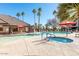 Community pool and spa with lounge chairs at 14950 W Mountain View Blvd # 2301, Surprise, AZ 85374