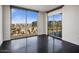 Modern bedroom featuring expansive windows showcasing city views and sleek flooring at 15215 N Kierland Blvd # 632, Scottsdale, AZ 85254