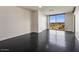 Bright bedroom with large window offering scenic views and dark flooring at 15215 N Kierland Blvd # 632, Scottsdale, AZ 85254