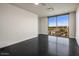 Bright bedroom with large window and city views, dark flooring at 15215 N Kierland Blvd # 632, Scottsdale, AZ 85254