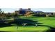 Golf course view with players and resort in background at 15215 N Kierland Blvd # 632, Scottsdale, AZ 85254