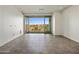 Spacious living room with tiled floors and access to a private balcony at 15215 N Kierland Blvd # 632, Scottsdale, AZ 85254