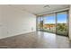 Bright living room with tiled floors and sliding glass doors leading to a balcony with city views at 15215 N Kierland Blvd # 632, Scottsdale, AZ 85254