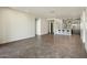 Open living area with tile flooring and a view into a modern kitchen at 15215 N Kierland Blvd # 632, Scottsdale, AZ 85254