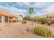 Landscaped backyard with gravel, plants and pathways at 15225 W Via Manana Dr, Sun City West, AZ 85375