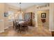 Bright dining room with a wooden table and hutch, perfect for Gathering meals at 15225 W Via Manana Dr, Sun City West, AZ 85375