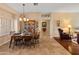 Bright dining room with a wooden table and hutch, perfect for Gathering meals at 15225 W Via Manana Dr, Sun City West, AZ 85375