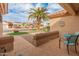 Peaceful front patio with seating area, overlooking the landscaped yard at 15225 W Via Manana Dr, Sun City West, AZ 85375