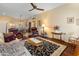 Living room with hardwood floors and comfortable seating at 15225 W Via Manana Dr, Sun City West, AZ 85375