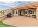 Relaxing patio with seating area and view of the backyard at 15225 W Via Manana Dr, Sun City West, AZ 85375