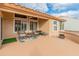 Covered patio with wicker furniture and ceiling fan at 15225 W Via Manana Dr, Sun City West, AZ 85375