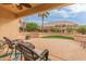 Relaxing patio with wicker chairs, overlooking backyard at 15225 W Via Manana Dr, Sun City West, AZ 85375