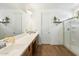 Bright bathroom with double vanity, large shower, and modern fixtures at 16780 W Cameron Dr, Surprise, AZ 85388