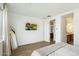 Main bedroom with ensuite bathroom access and neutral decor at 16780 W Cameron Dr, Surprise, AZ 85388